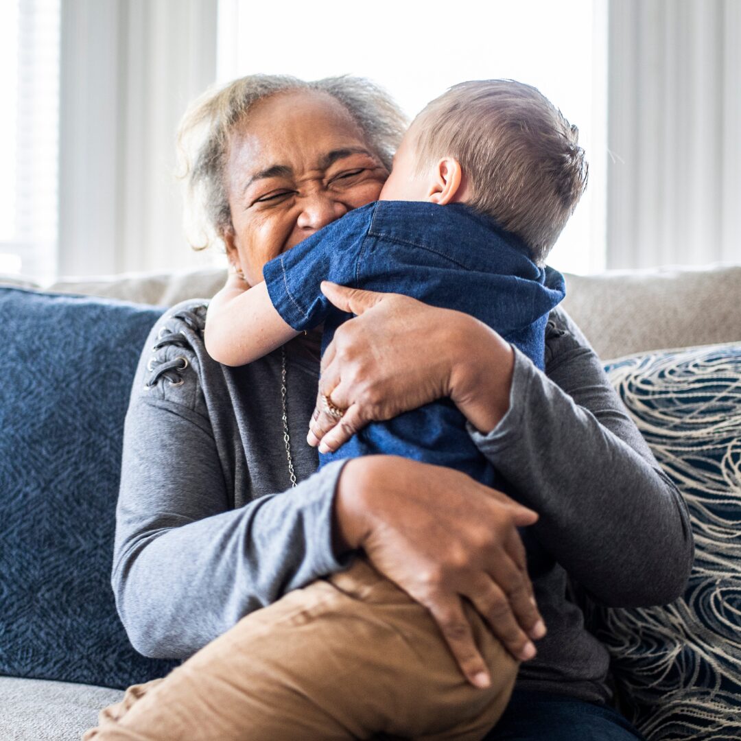 Child hugging their grandparent