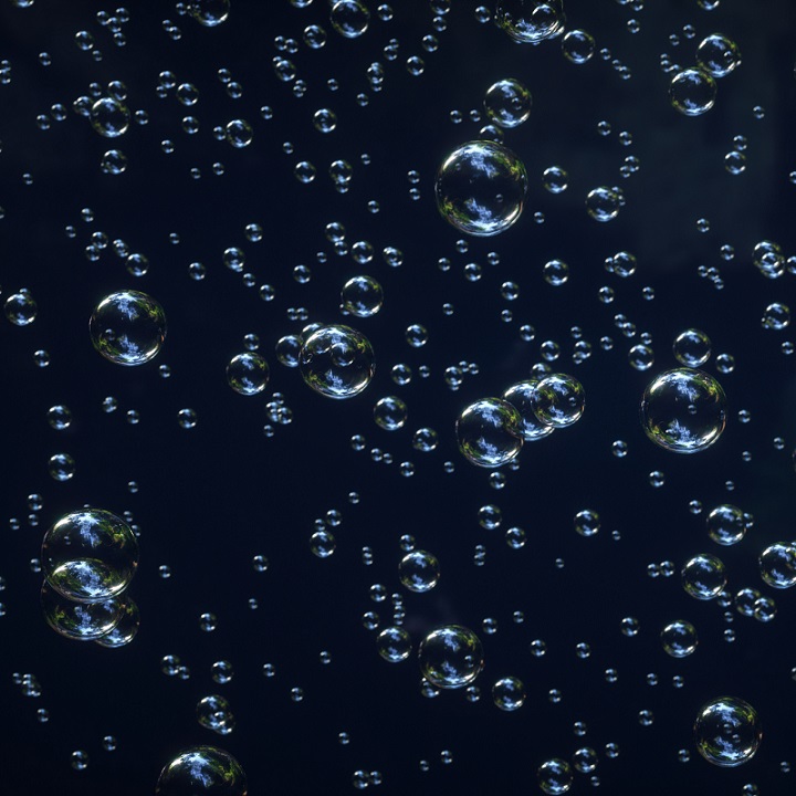 Clear bubbles on a dark background.